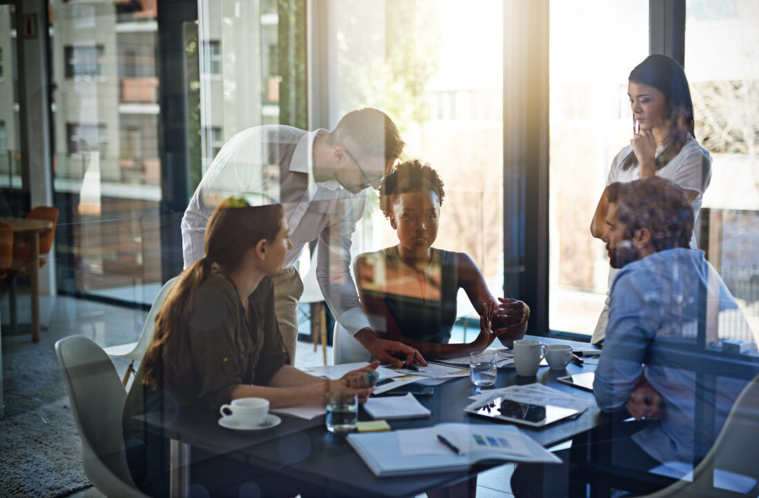 They give their all at work. Shot of a group of businesspeople having a meeting in a boardroom.