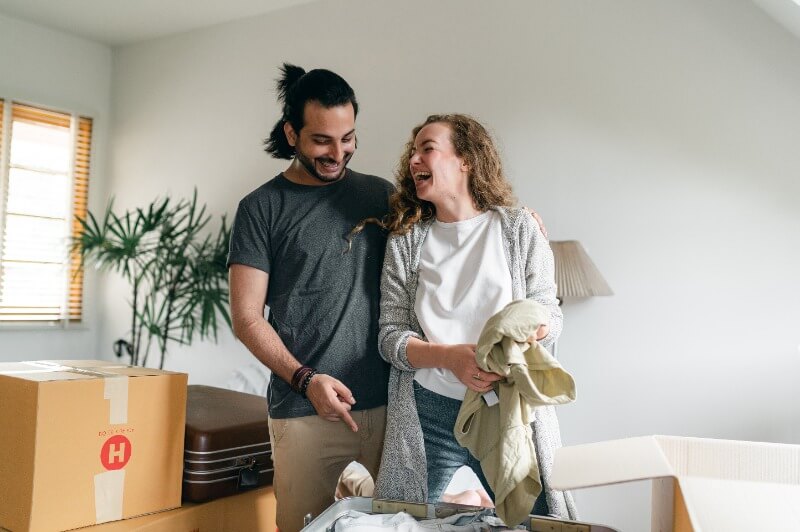 excited-couple-unpacking-boxes-in-new-apartment-4245903 moving in together LOW RES