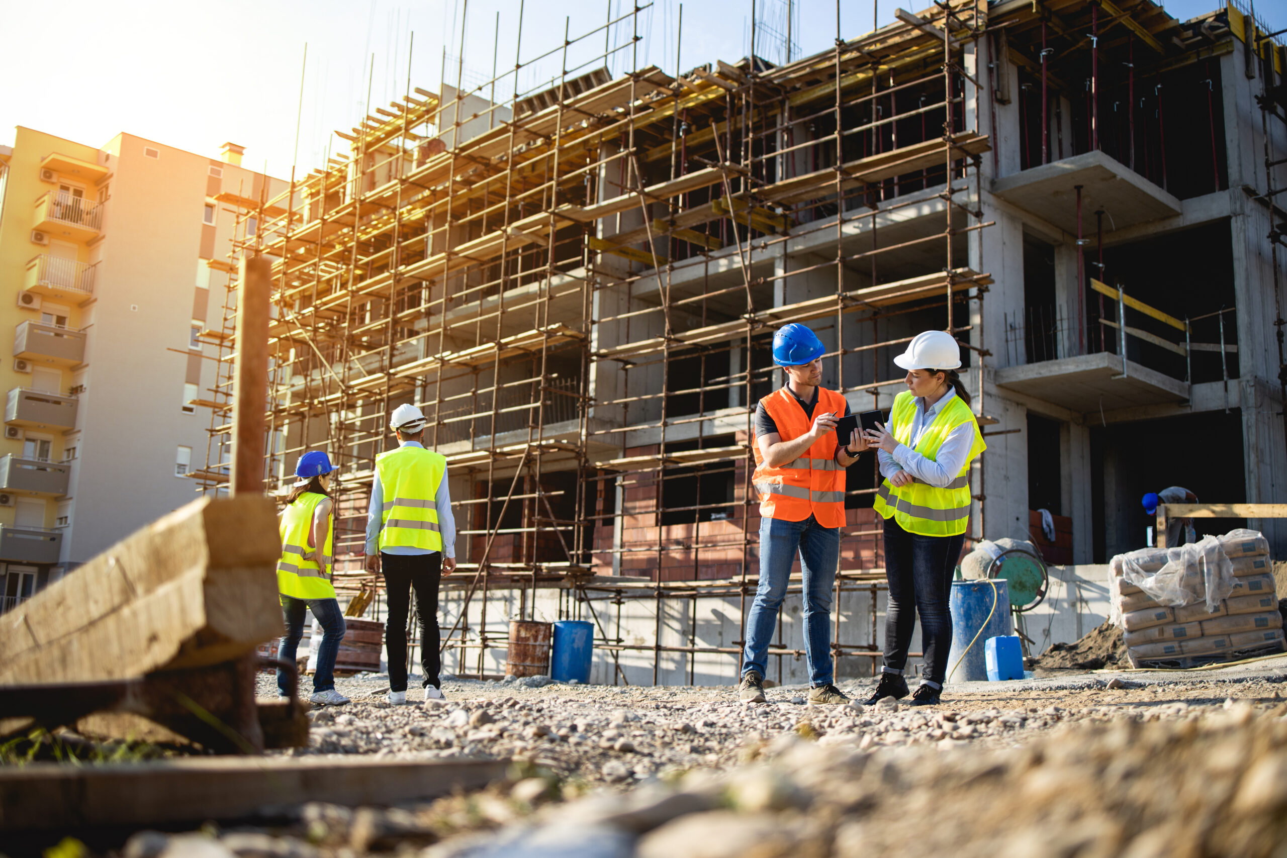 Four construction workers having meeting,stock photo